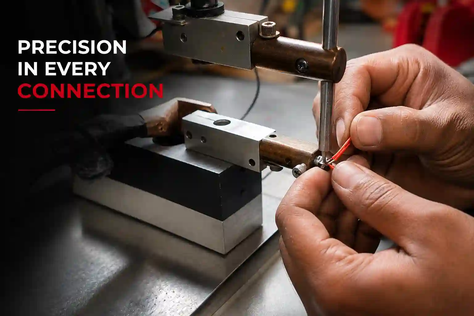Technician assembling RTD sensor wires during precision industrial temperature sensor manufacturing